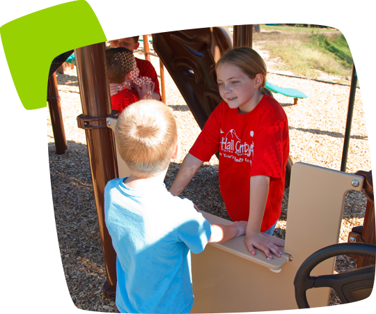 boy & girl playing on a byo playground