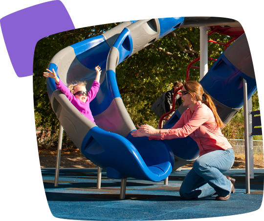 mom & daughter on playground slide
